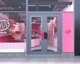 En rosa och vit butiksfasad för Bubs Stockholm. En stor oval logotyp med texten "BUBS STHLM" syns på skyltfönstret.